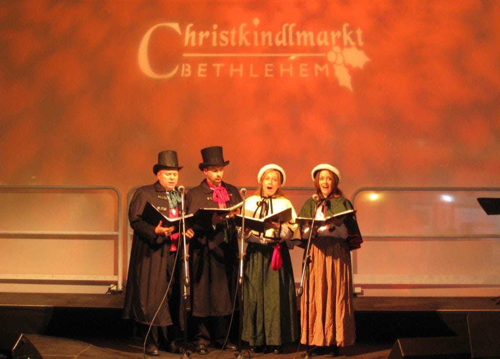 The carolers perform on the main stage at Christkindlmarkt in Bethlehem, PA.