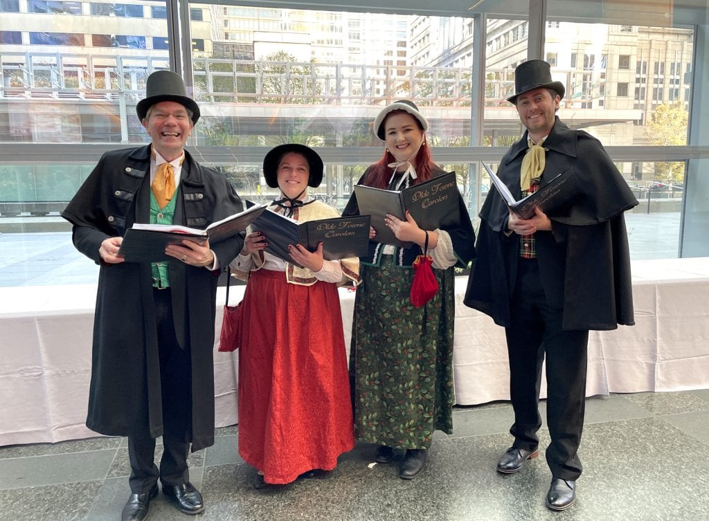 The carolers perform for Comcast Xfinity's corporate Christmas party in 2022.