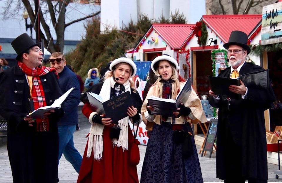 The carolers perform at the Easton Winter Market.
