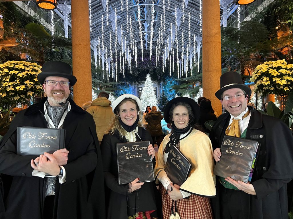 Our carolers pose in one of Longwood's amazing rooms in 2021.
